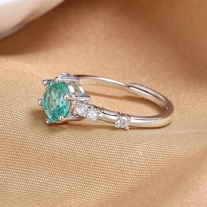 Maldives green open ring with silver finish and round center stone in six-prong setting