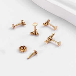 G23 titanium golden cartilage studs set featuring leaf and flower zircon designs