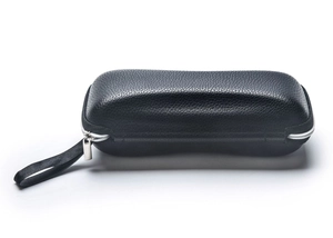 Close-up of black lychee leather sunglass case with silver zipper and wrist strap