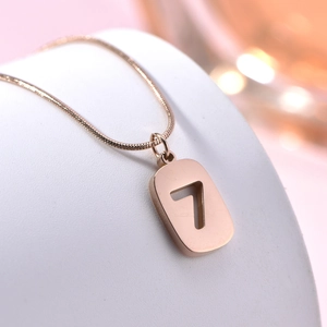 Elegant rose gold titanium steel necklace featuring a hollow number 7 rectangular pendant