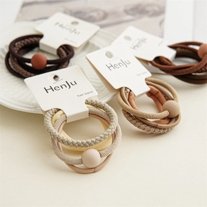4-piece set of minimalist earth tone hair elastics with matte beads and braided cords