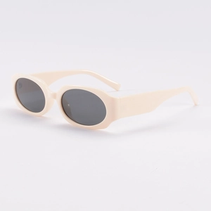 Retro cream white oval sunglasses with dark gray lenses for casual outdoor street style