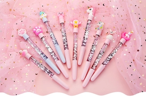 Close-up of 10-piece creative cartoon liquid quicksand pens with cute unicorn charms
