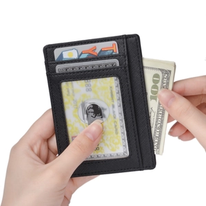 Detailed view of RFID leather card holder with Saffiano texture and clear ID window slot