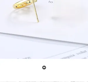 Detailed close-up of S925 silver stud earrings with gradient moon and star design