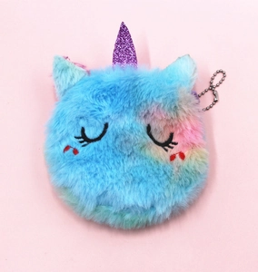 Detail of blue plush unicorn coin purse with sequins horn and metal keychain chain