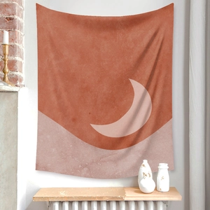 Detail of bohemian sun moon tapestry featuring terracotta crescent and minimalist shapes