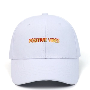 Close-up of POSITIVE VIBES embroidery on white twill cotton baseball cap detail