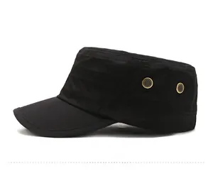 Close-up of black cotton military flat top cap showing golden eyelets and fabric texture