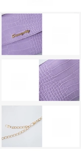 Dettaglio di pelle goffrata coccodrillo viola chiaro con logo oro e tracolla a catena