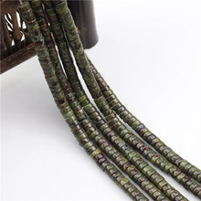 Detailed view of natural green stone spacer beads with unique textures for DIY jewelry
