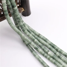 Close-up of green square natural stone spacer beads with unique textures for DIY jewelry