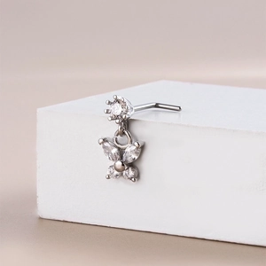 Surgical steel L-shaped nose stud with sparkling zircon crown and butterfly charm