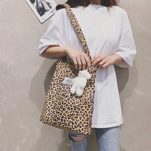 Leopard print canvas tote bag with shoulder straps and cute plush bear charm