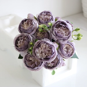 Close-up of purple silk artificial peony bouquet with multiple heads for home wedding decor