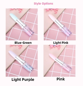 Close-up of lipstick-shaped gel pens with colorful liquid glitter and star sequins