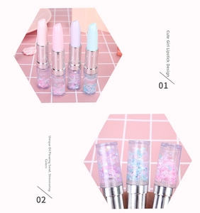 Detail of creative lipstick-shaped pens featuring flowing glitter sand and pastel colors