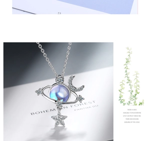 Macro shot of silver cosmic pendant with moonlight stone and white cubic zirconia