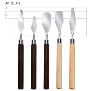 Five assorted stainless steel palette knives with wooden handles and size measurements