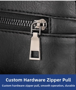 Detail of silver metal zipper on premium black leather backpack with lychee texture