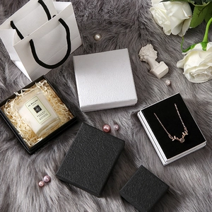 Minimalist black and white textured jewelry gift boxes with matching paper carry bag