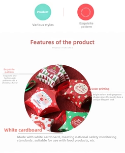 Detailed view of star-shaped Christmas candy gift boxes with festive patterns and red ribbons