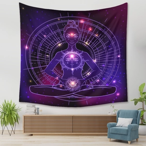 Detail of bohemian purple meditation tapestry with sun motif hanging in a cozy living room