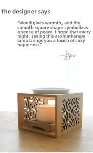 Detail of wooden aromatherapy burner with carved patterns and white ceramic bowl