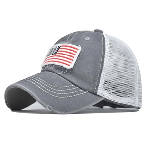 Detailed side view of washed cotton baseball cap with mesh back and US flag patch