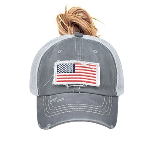 Detail of distressed grey cotton baseball cap with embroidered American flag patch