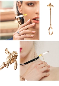 Detailed view of bee-shaped gold metal cigarette holder ring for smoking accessories