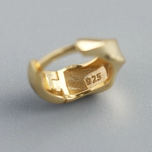 Minimalist S925 sterling silver twisted hoop earrings with a polished golden finish