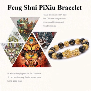 Artistic detail of Pi Xiu black agate bracelet featuring golden beads and traditional motifs