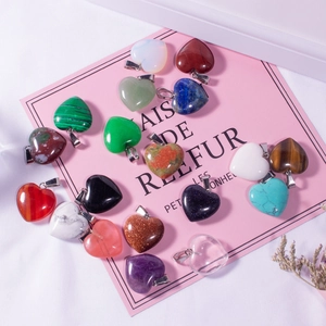 Collection of colorful heart-shaped natural agate crystal pendants with silver bails