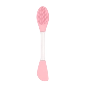 Detailed close-up of a pink dual-head silicone face mask brush with scraper and soft bristles