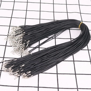 Close-up of black 1.5mm waxed cord necklaces with silver lobster clasps for DIY jewelry