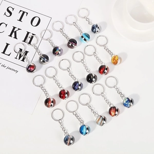 Solar system double-sided glass ball keychains featuring planets like Earth and Mars