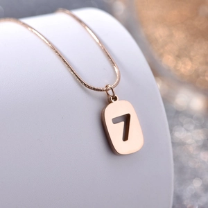 Rose gold titanium steel necklace featuring a rectangular number 7 pendant with snake chain