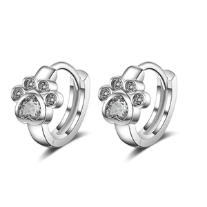 Detailed view of silver paw print hoop earrings with heart-shaped cubic zirconia stones