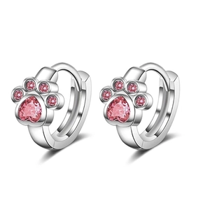 Detailed view of silver cat paw hoop earrings with pink heart-shaped cubic zirconia
