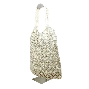 Handmade beige woven hollow mesh tote bag crafted with cotton rope in boho style