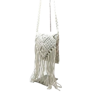 White boho macramé shoulder bag with fringe tassel and hand-woven geometric textures
