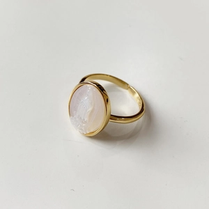 Close-up of gold 925 silver Maria shell relief on a vintage open adjustable ring