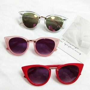 Vintage cat-eye sunglasses with oval metal bridge and colorful frames in three shades
