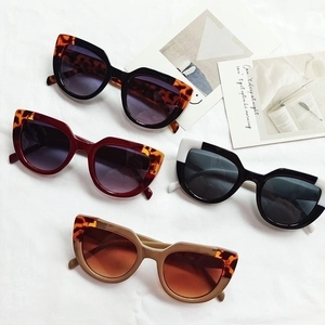 Fashionable cat-eye sunglasses for women in multiple colors on a stylish white background