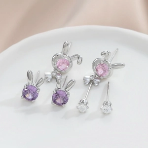 Three-piece set of silver rabbit stud earrings with purple and pink gemstones