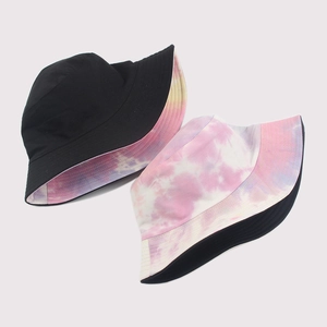 Reversible tie-dye bucket hat for men and women with black and colorful tie-dye patterns