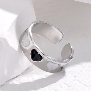 Minimalist silver stainless steel open ring featuring black and white heart patterns