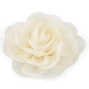 Macro detail of creamy white chiffon flower clip with soft layered fabric petals