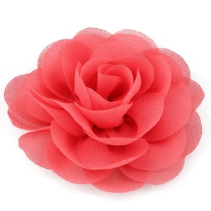 Detail of coral red handmade chiffon flower hair clip with layered rose petals